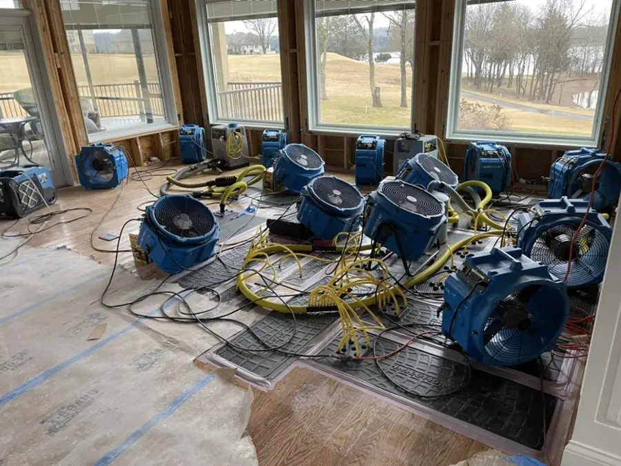 Multiple air movers drying a large room